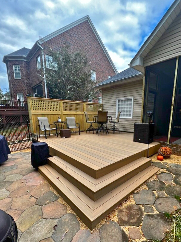 Composite deck in Huntersville NC with privacy screen, built by Archadeck of Charlotte.